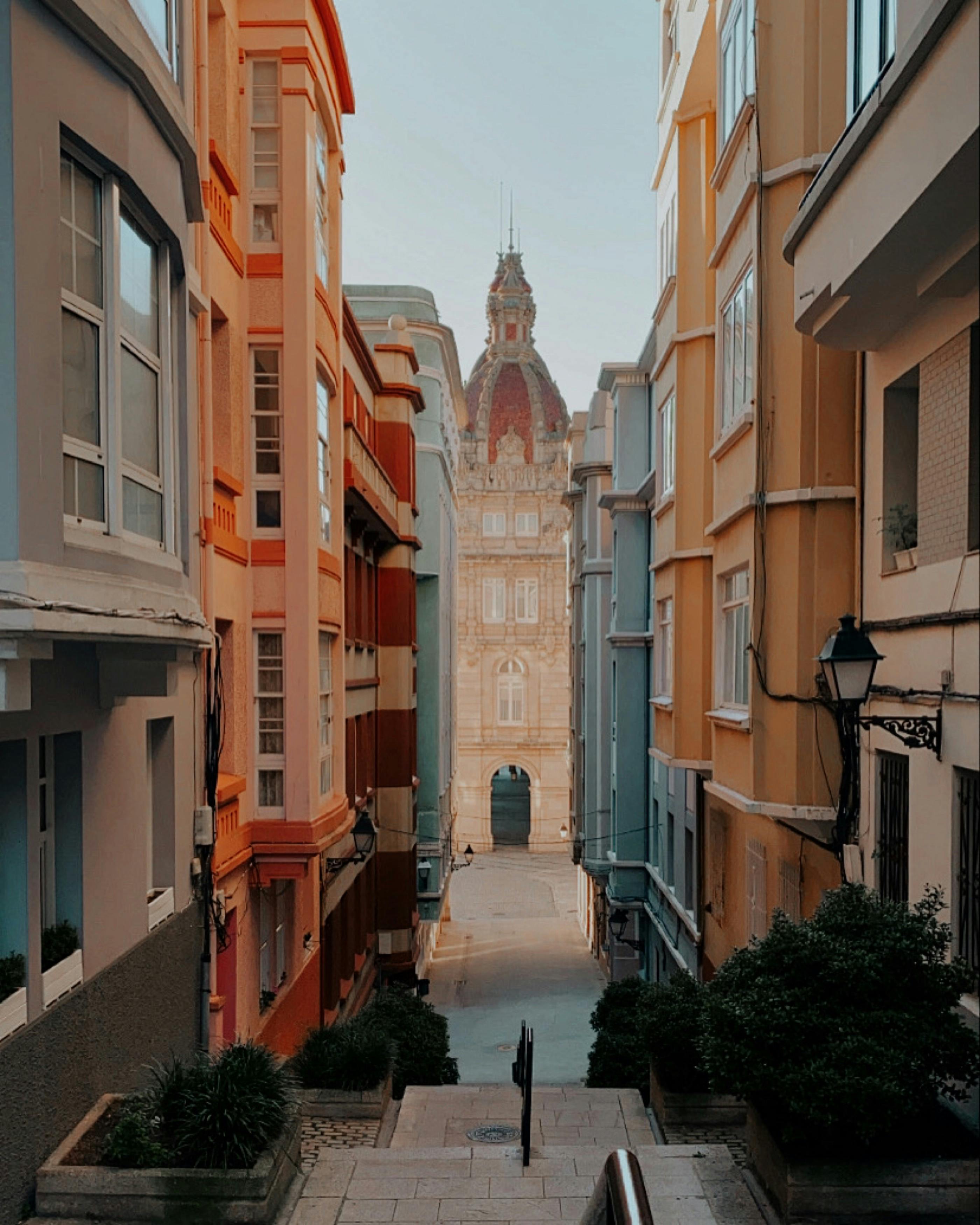 Alleyway between concrete buildings Gijón