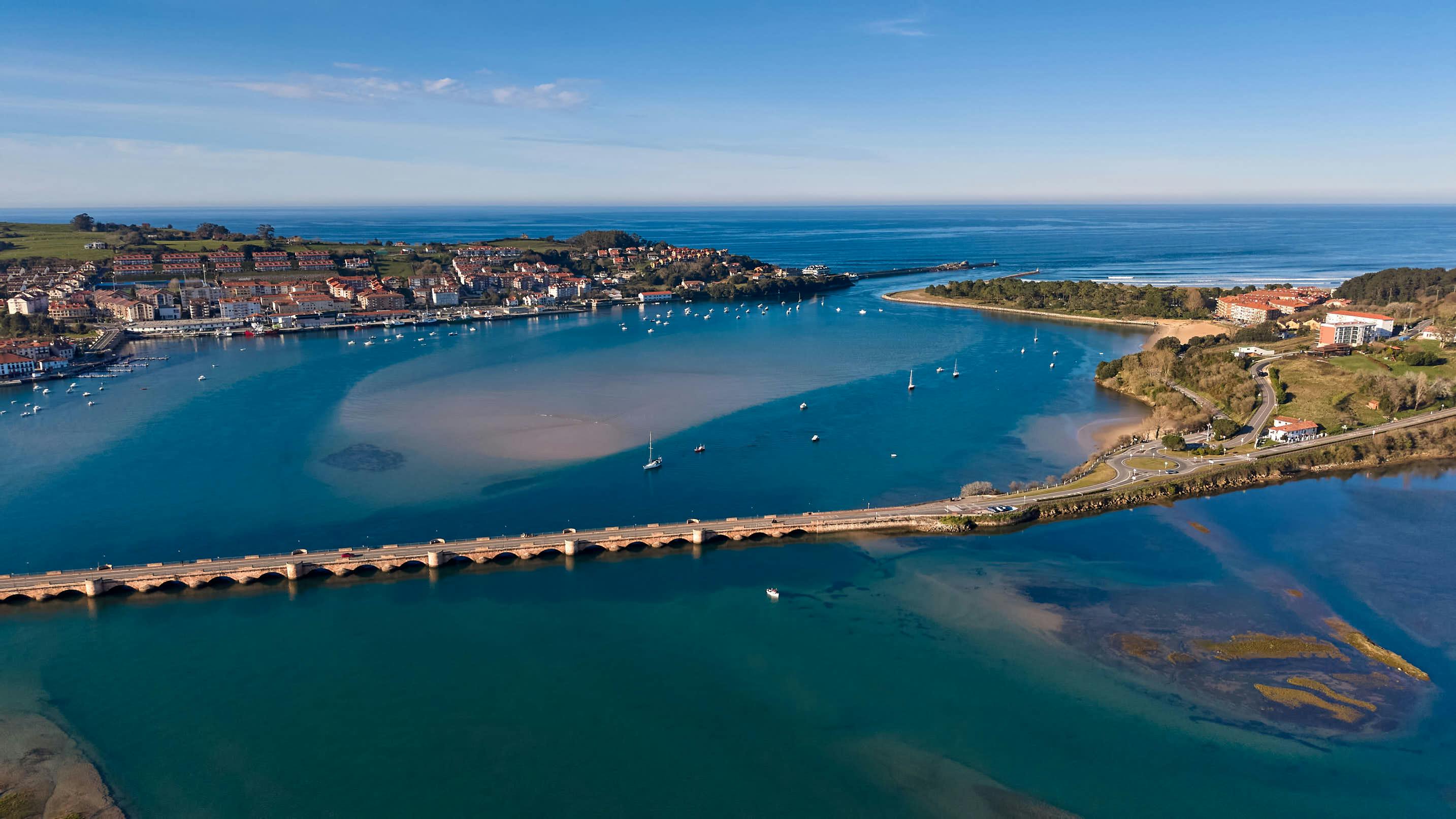 Aerial view Cantabria coastline with bridge Spain